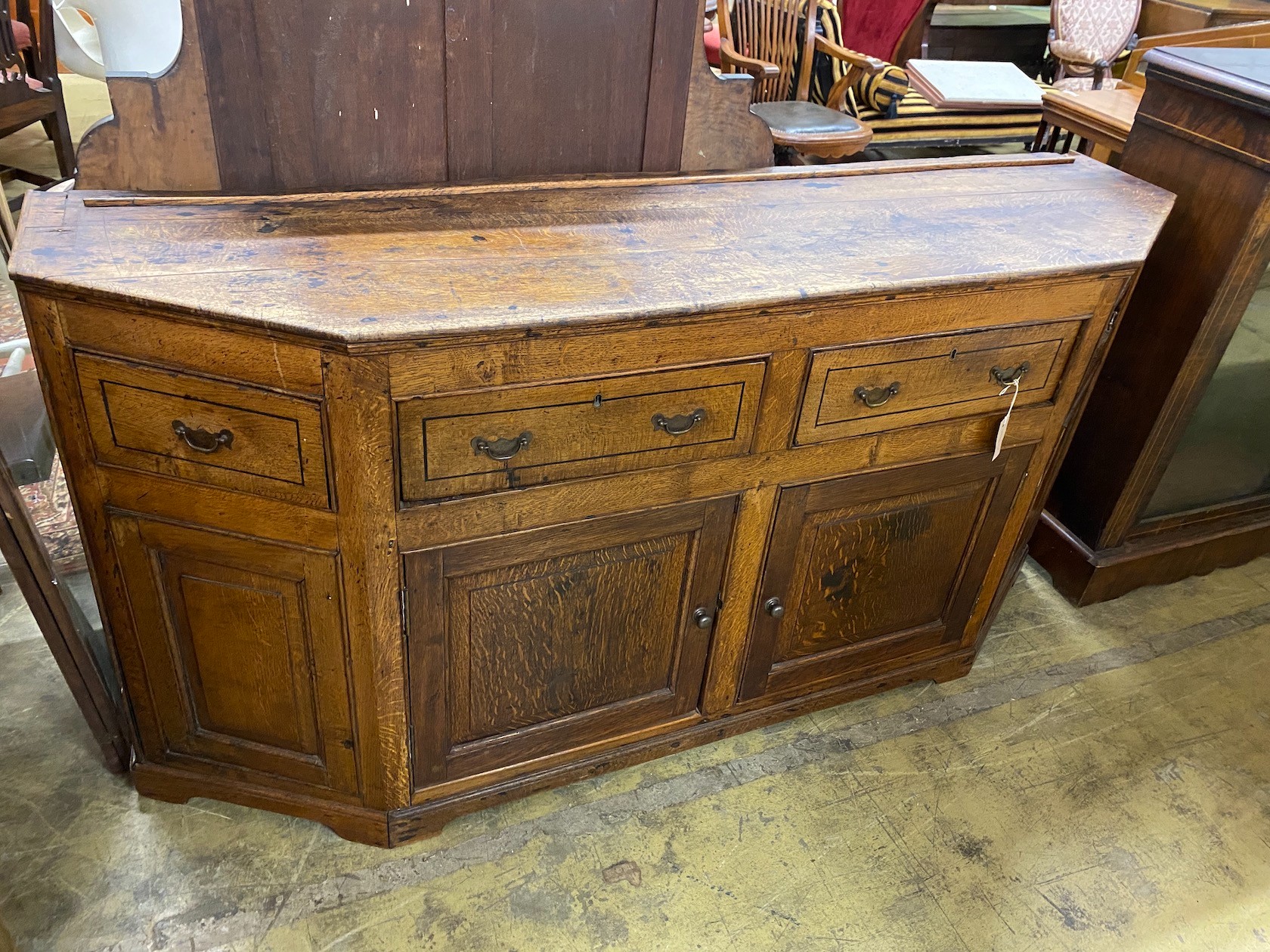An unusual George III oak breakfront low dresser, length 177cm, depth 48cm, height 87cm